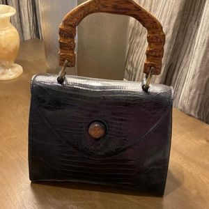 Skin black bag wooden handle